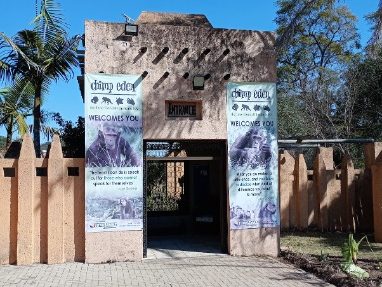 Entrance of a building with tall banners and a decorative, traditional-style façade.