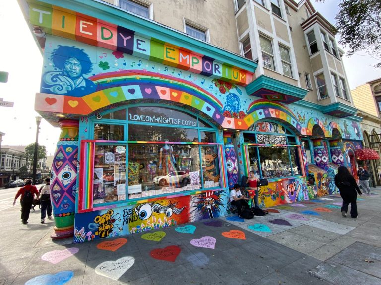 Colourful mural on a shopfront, featuring vibrant patterns and whimsical designs.