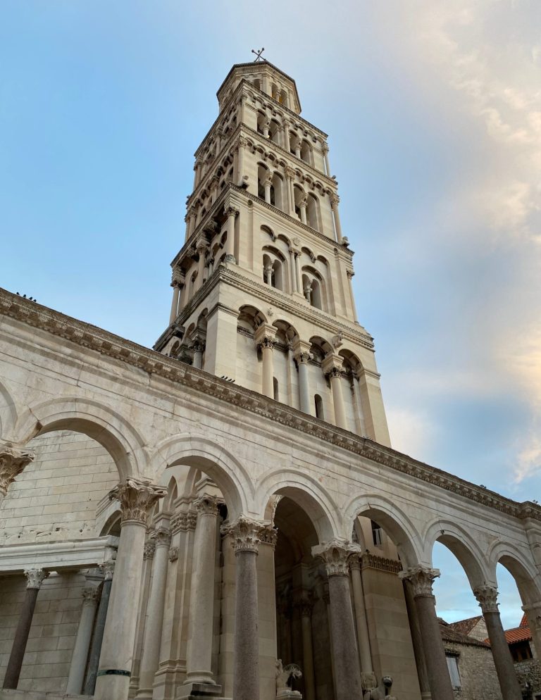 Cathedral of St Domnius Bell Tower Bell tower of Diocletian's Palace with arches and a clear blue sky.