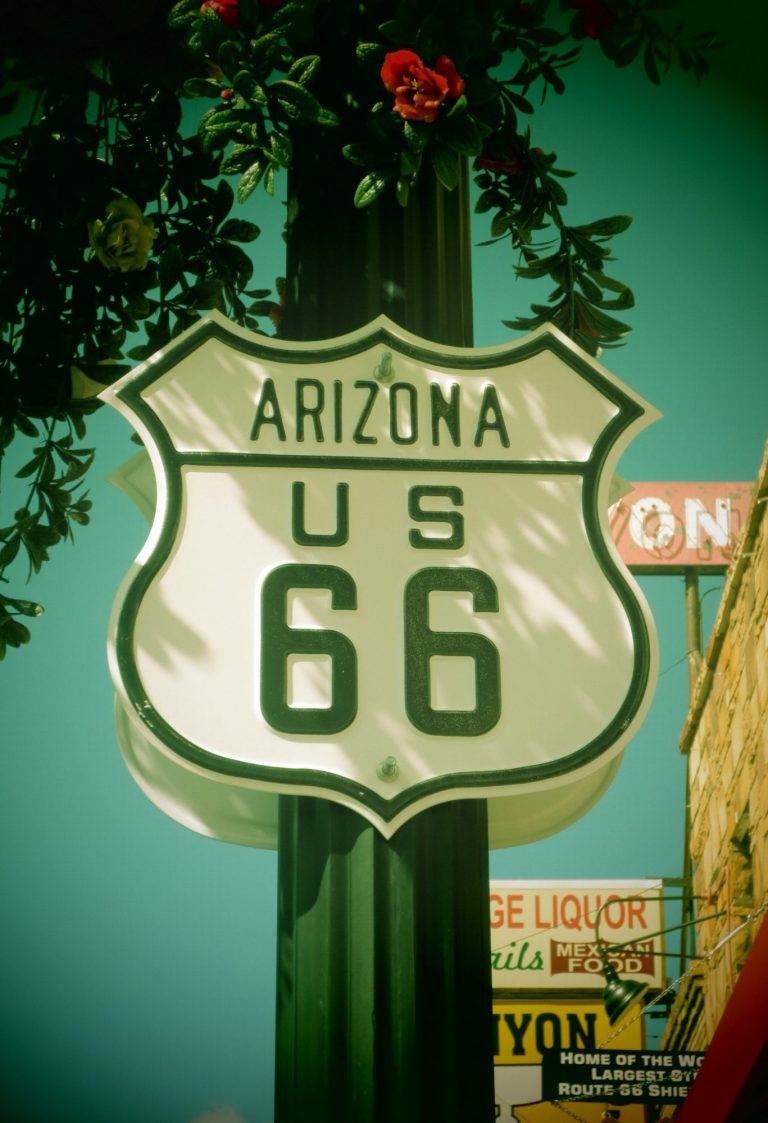 Sign for Arizona US Route 66 featuring a green and white shield design.
